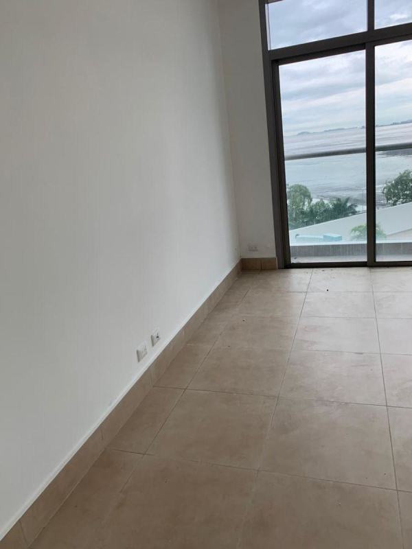 Spacious master bedroom with large windows and panoramic ocean view in PH Costa del Este Panama