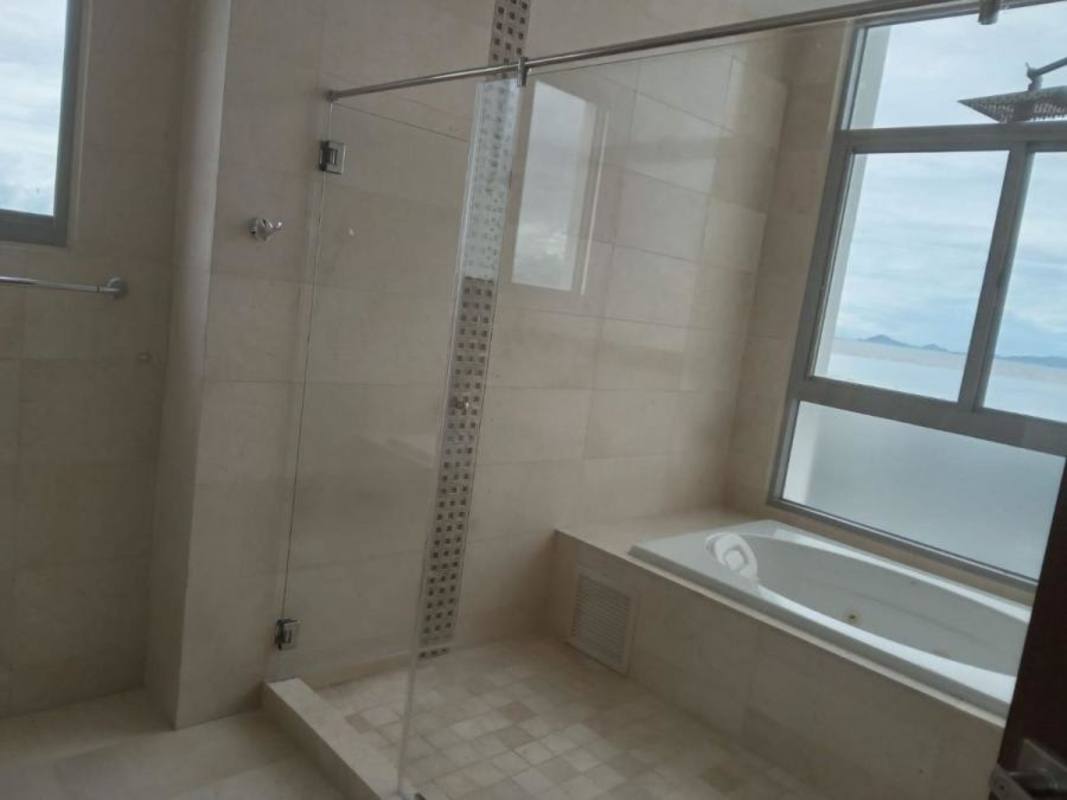 Modern bathroom with bathtub, glass shower and ocean views PH Costa del Este Panama