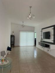 Modern living room tiled floor with mounted TV wall and natural light Villa Las Oropendolas Arraiján