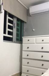 Minimalist dining space with mini fridge tile flooring ceiling light rental home Arraiján Panama