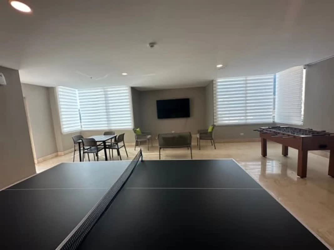 Modern game room and social lounge with ping pong foosball and seating PH Pacific Point Panama