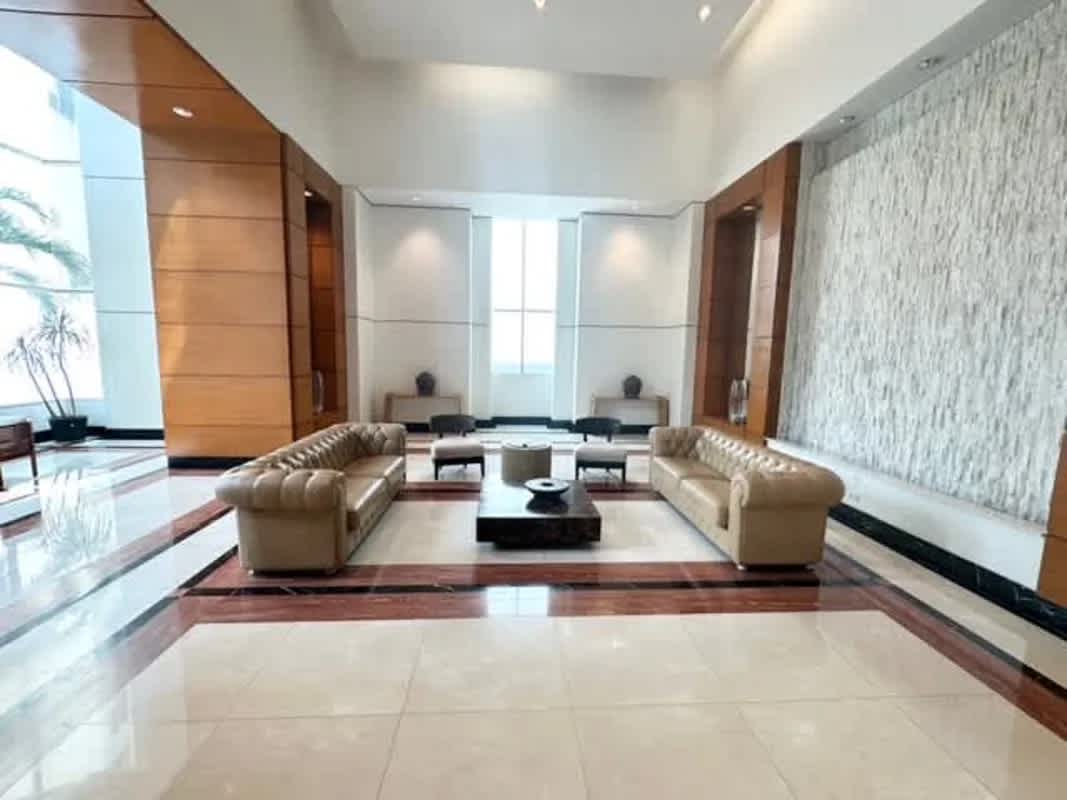 Elegant high-ceiling lobby with marble and plush seating PH Pacific Point Punta Pacifica Panama