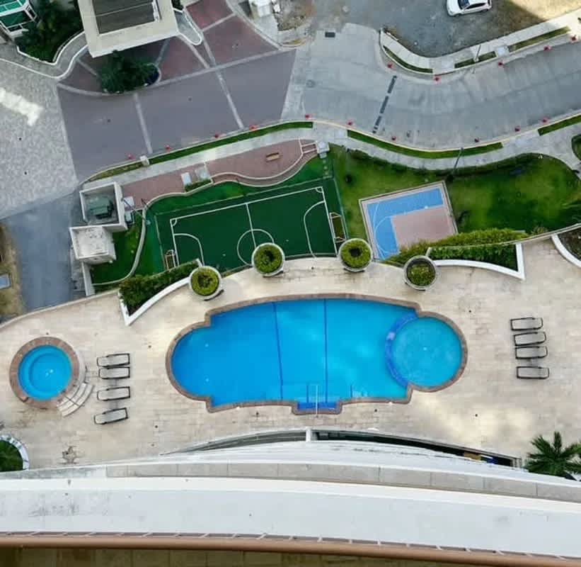 Aerial photo luxury complex with pool, hot tub, tennis and landscaped gardens at PH Pacific Point Panama