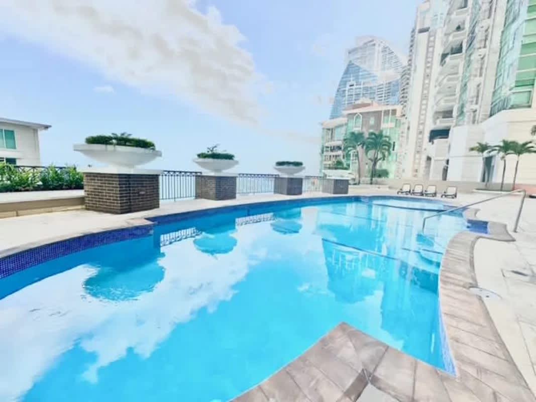 Contemporary luxury condominium entrance with arches columns and glass doors PH Pacific Point Panama