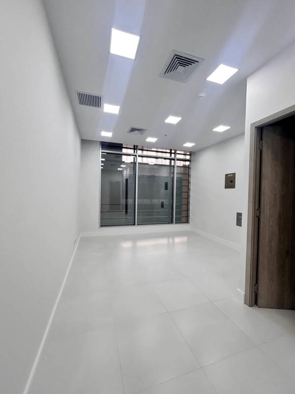 Empty modern office suite with large windows and tiled floors for rent in Town Center