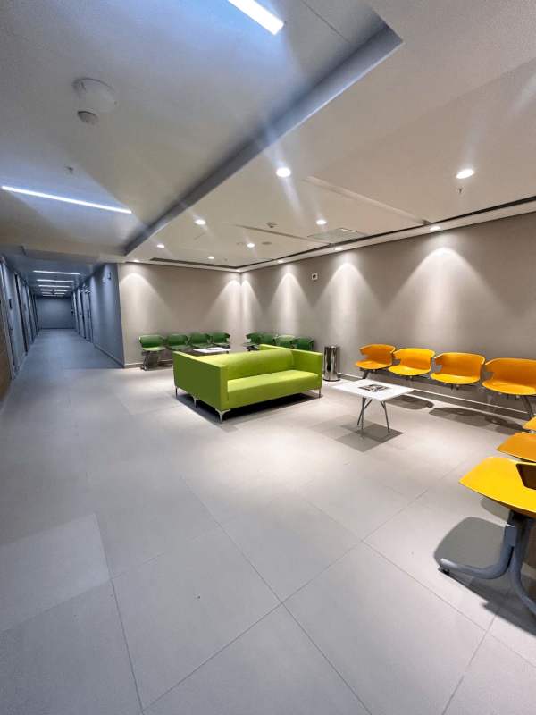 Contemporary lounge area with red chairs and city view Town Center Panama