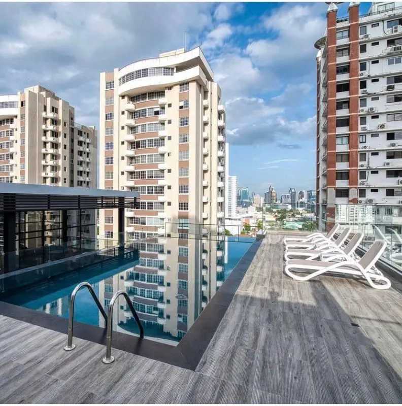 Minimalist kitchen with granite counters, stainless steel appliances in furnished apartment PH San Francisco Bay Panama