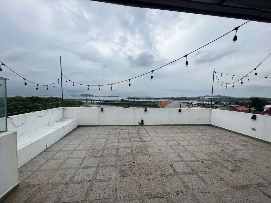 Rooftop terrace with pergola, bar counter, string lights, city view Casco Viejo Panama