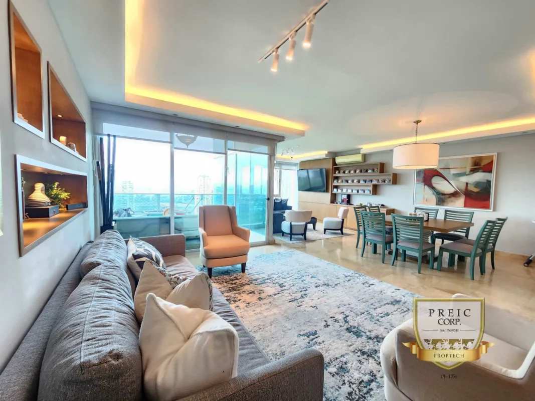 Open-plan living and dining with balcony access and city views in PH Titanium Costa del Este Panama