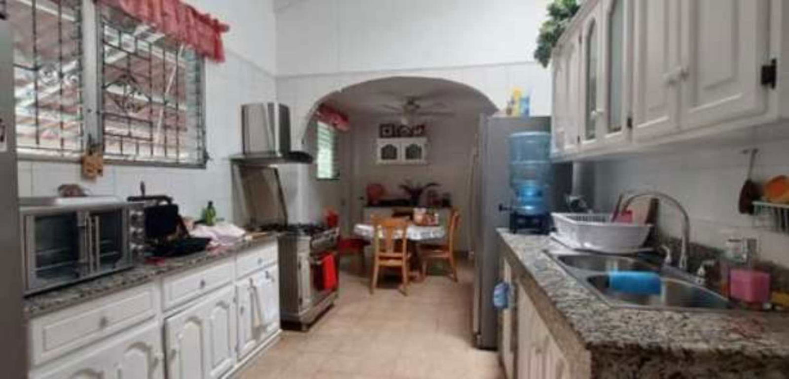 Covered patio with wooden ceiling, decorative fountain garden view Betania Panama
