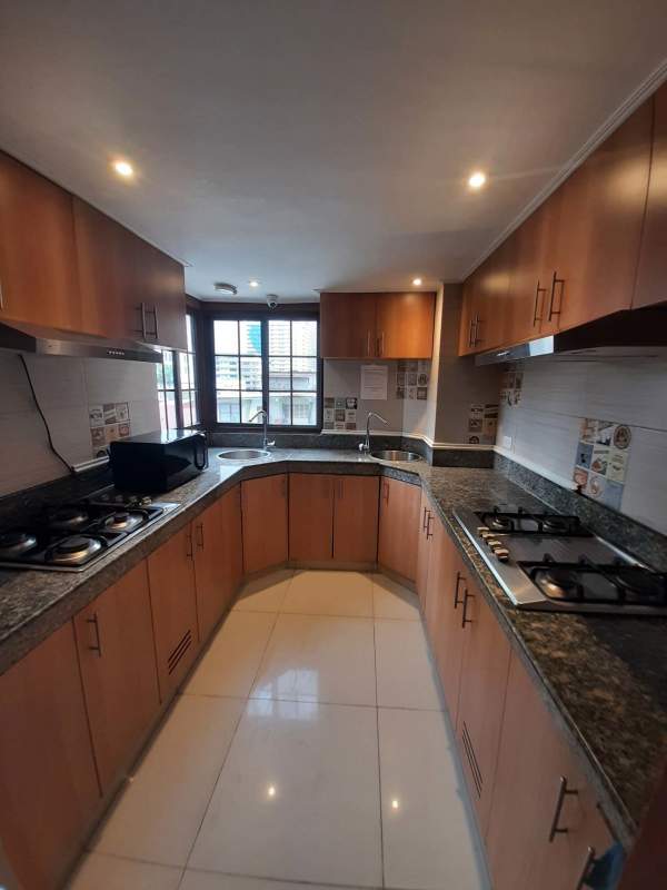 Bright furnished bedroom with double bed, large closet, AC and fridge at Casa Rica Banking District Panama