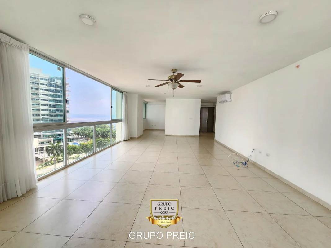 Living and dining room with balcony ocean views in PH Lumiere Costa del Este