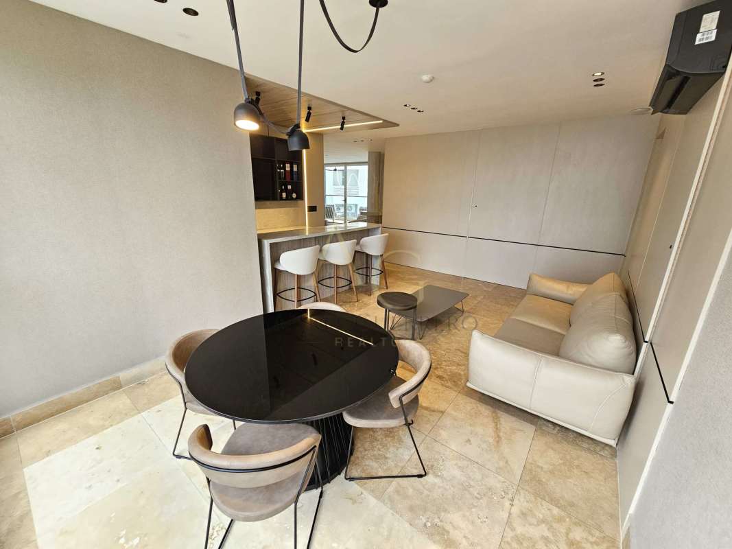 Modern bedroom with floor-to-ceiling windows and ocean skyline view in PH Ocean Club Punta Pacifica
