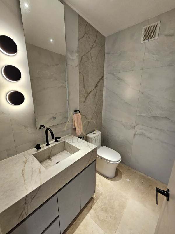 Luxurious marble-finished bathroom with glass shower at luxury condo PH Ocean Club Punta Pacifica