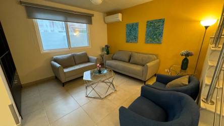 Community swimming pool and lounge area at Bosques del Pacífico Panama Pacifico