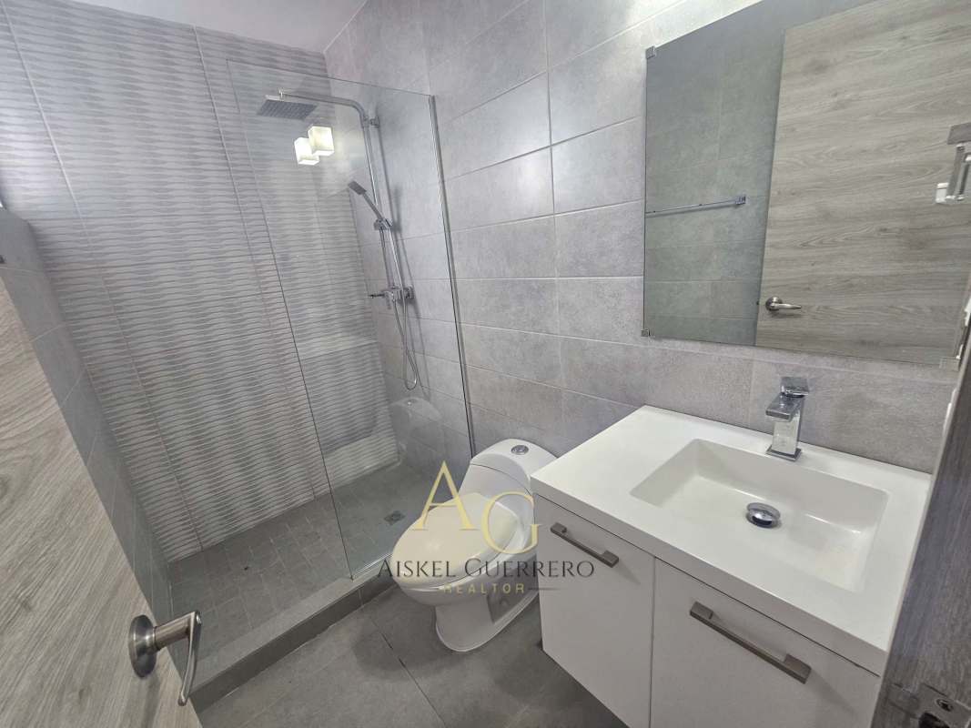 Modern gym with cardio equipment overlooking city skyline at Signature Point Panama City