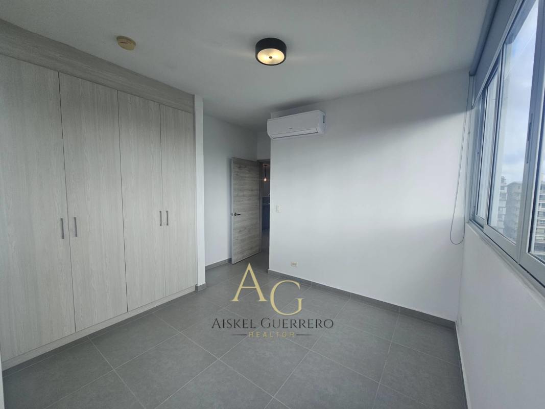 Bathroom with walk-in glass shower, modern vanity at Signature Point Panama City apartment
