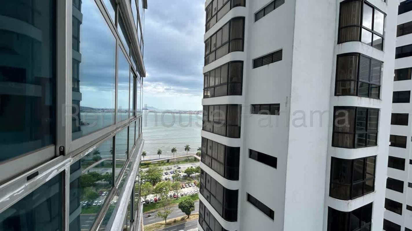 Infinity swimming pool with ocean and skyline view on rooftop at Bayfront Tower Panama City