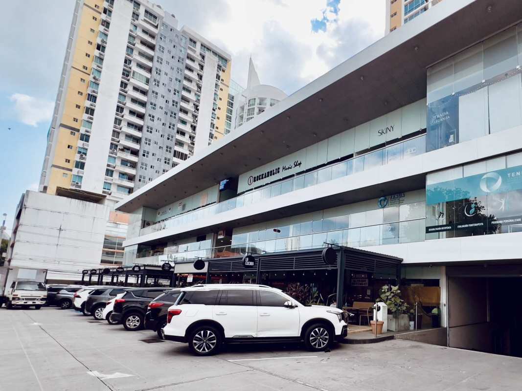 Multi-level facade with retail shops and parking at San Francisco Business Plaza Panama City