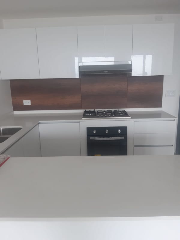 Open modern kitchen with granite countertops and cabinetry in PH Park City El Cangrejo Panama