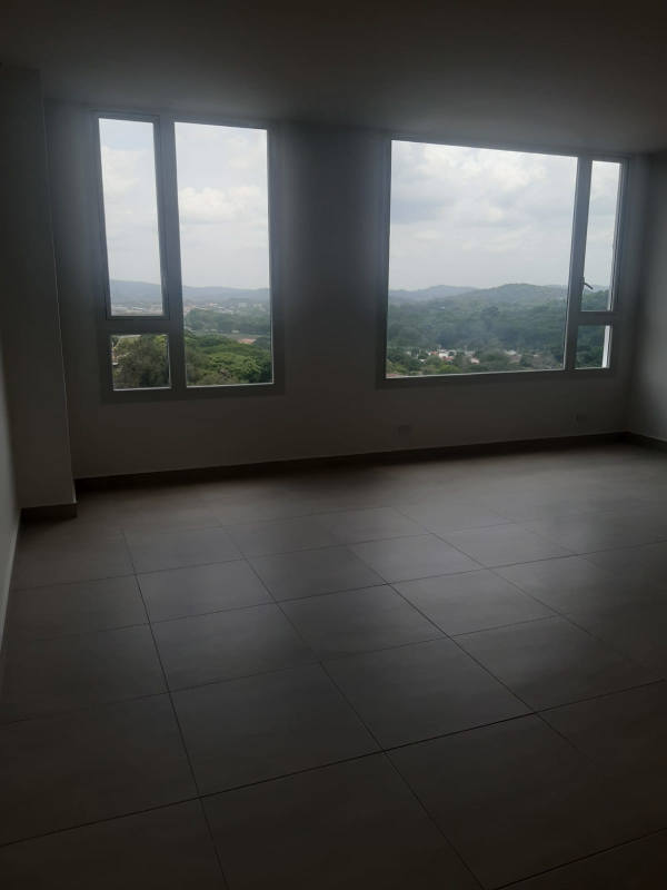 Infinity rooftop swimming pool with lounging area and skyline views in PH Park City Panama City