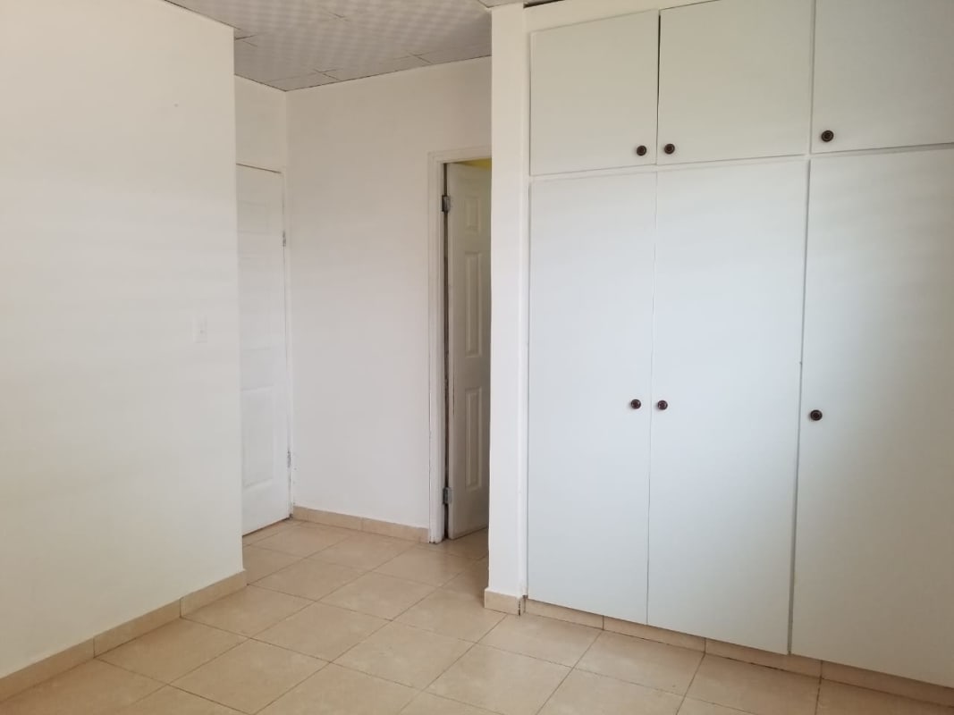 Functional white kitchen with granite countertops in house for sale Cerro Viento San Antonio Panama