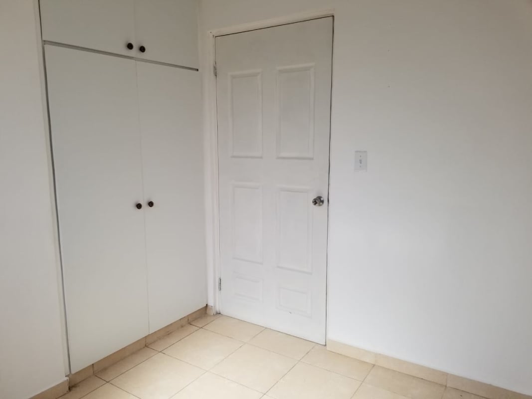 Large living dining room with tiled floor and bright windows in house for sale Cerro Viento Panama