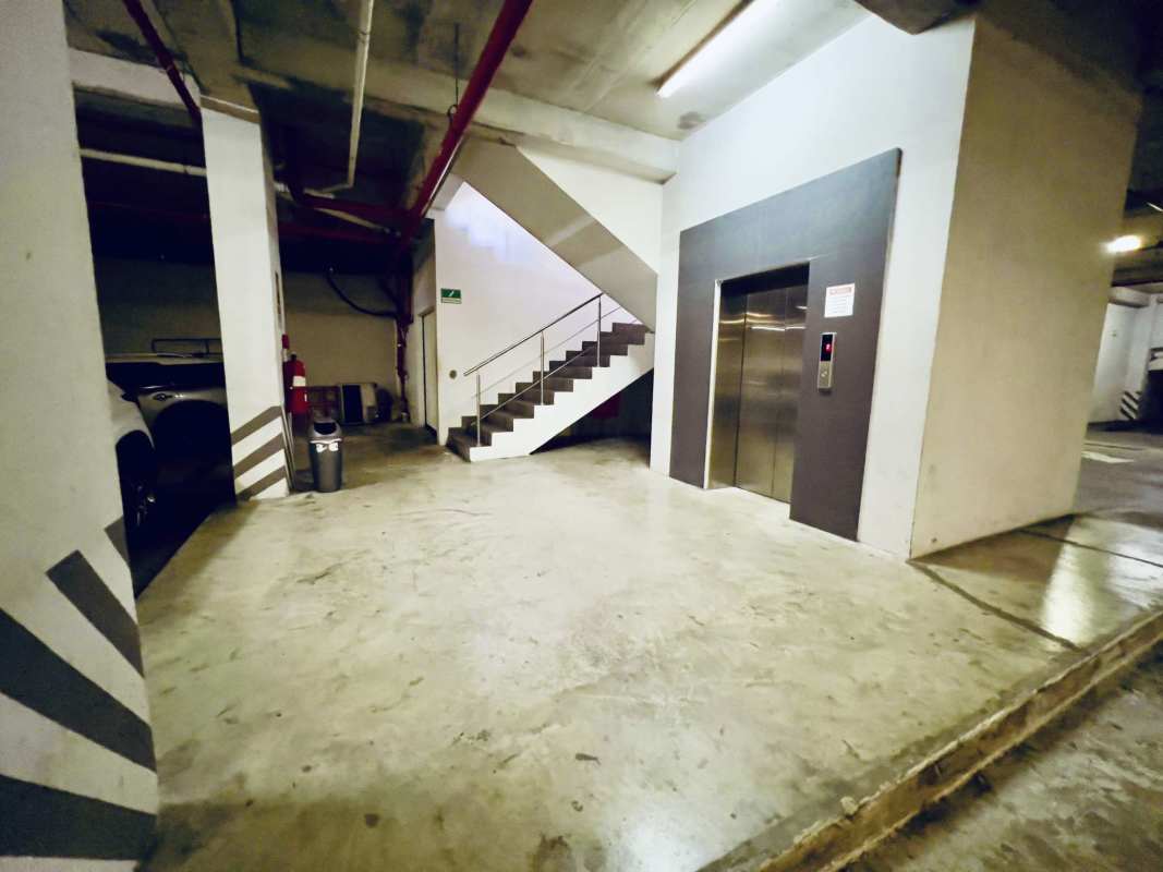 Contemporary two-story shopping plaza with glass and parking Panama City