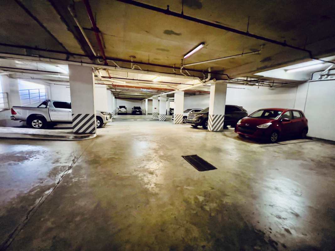 Parking garage entrance with elevator and stairs in commercial plaza San Francisco Panama