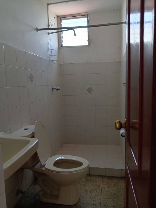 Bathroom with white tiles small window walk-in shower PH Santa Elena Residences Chanis Panama