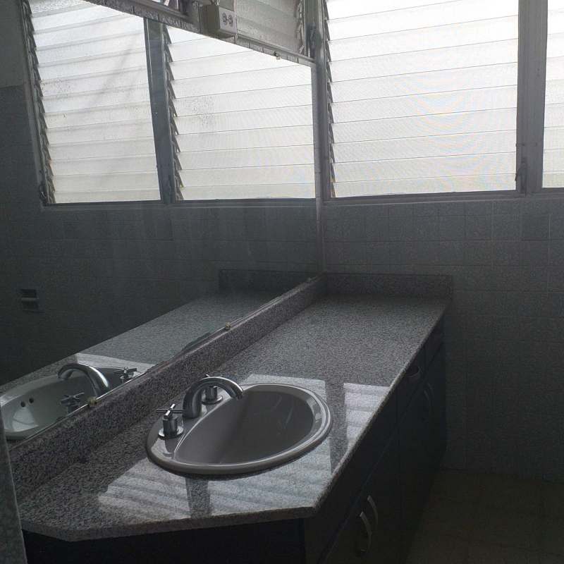 Minimalist bathroom granite countertop large wall mirror jalousie window PH Vista Mar