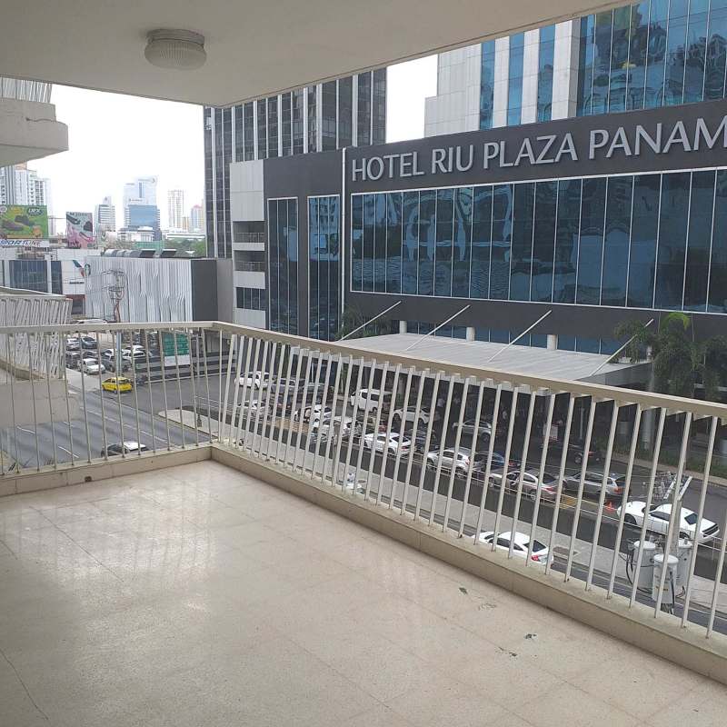 Balcony with metal railing city skyline Hotel Riu Plaza view PH Vista Mar Panama