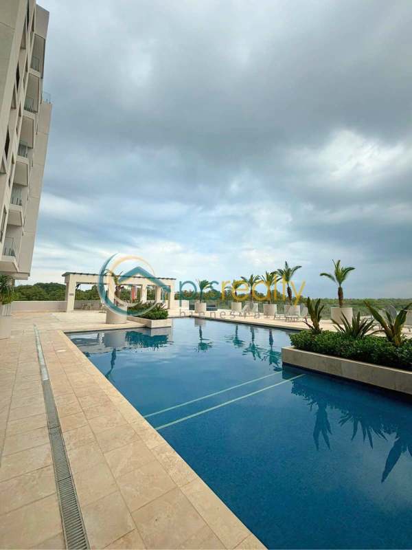 Blue rooftop padel court with safety fencing at PH Ocean House Panama City