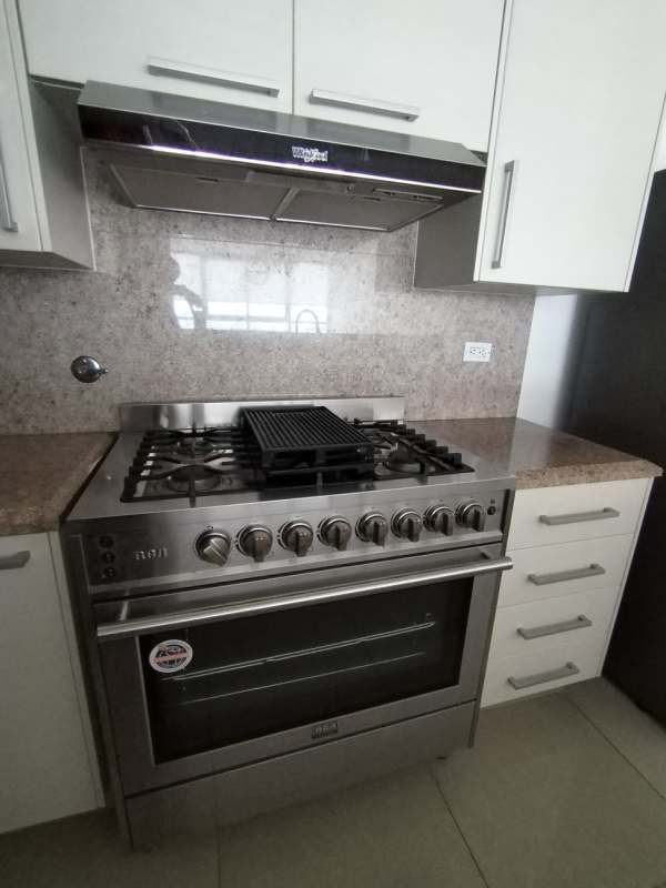 Bedroom corner with wall-mounted TV, modern decor, Top Tower Costa del Este Panama