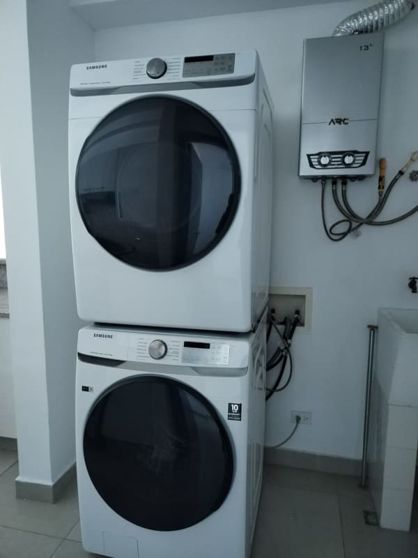 Open plan living dining room with large windows, city views in Top Tower Panama