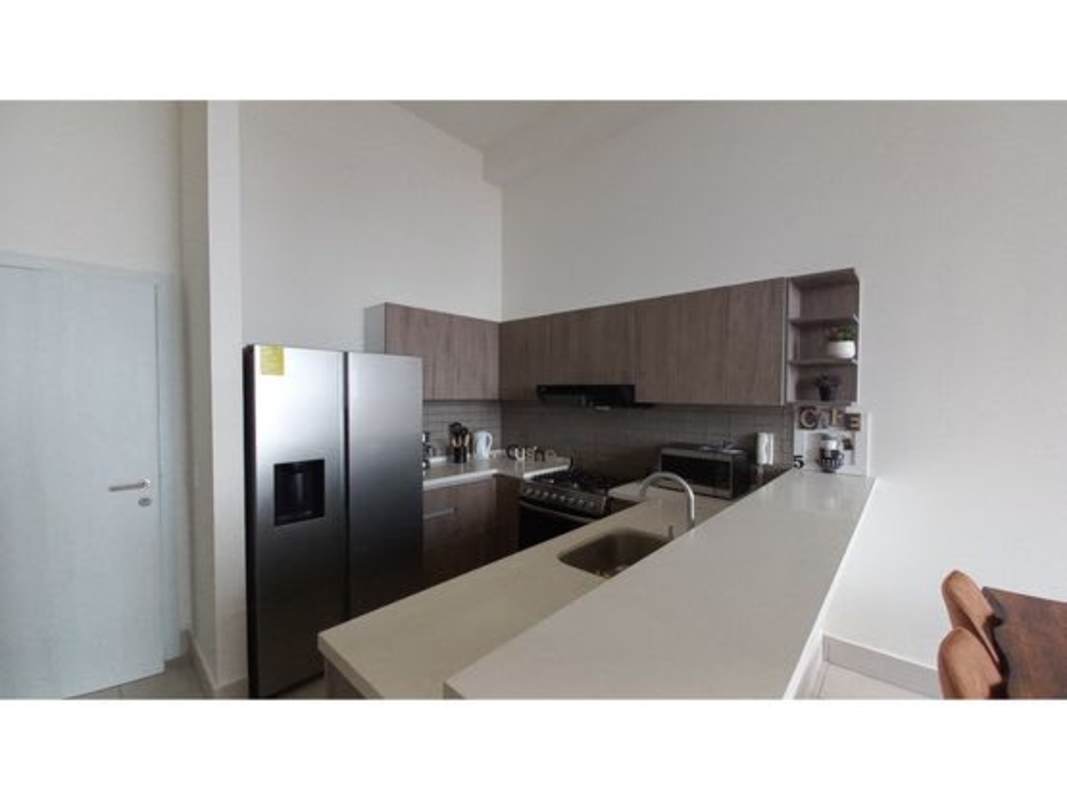 Living room with panoramic ocean skyline views, access to balcony, bright space at PH Coco del Mar Panama