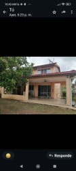 Front facade of two-level house with garden and driveway in Howard, Panama