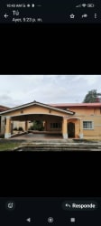 Covered porch with arches and tile floor at family house in Howard Panama