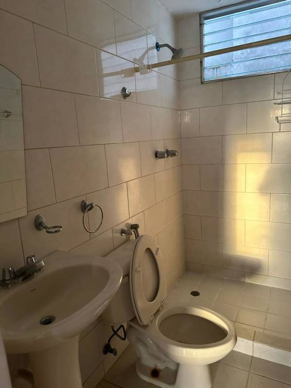 Bedroom with tiled floor, window, ceiling fan in PH Central Park Tower Tribeca Panama City