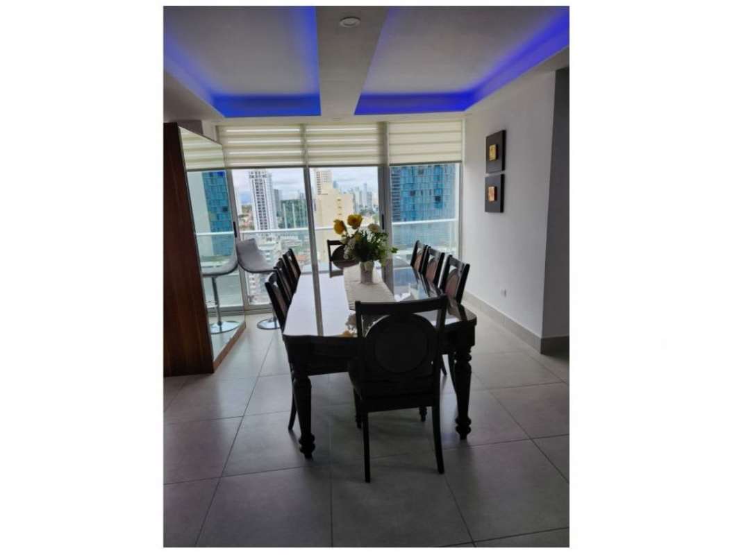 Bedroom with large windows and city skyline views at PH Park City Obarrio Panama City