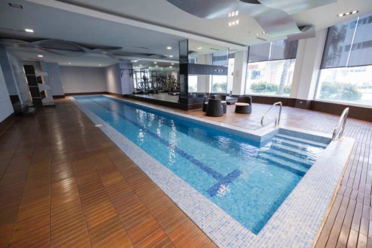 Spacious loft living area double height windows panoramic ocean views Punta Pacifica Panama