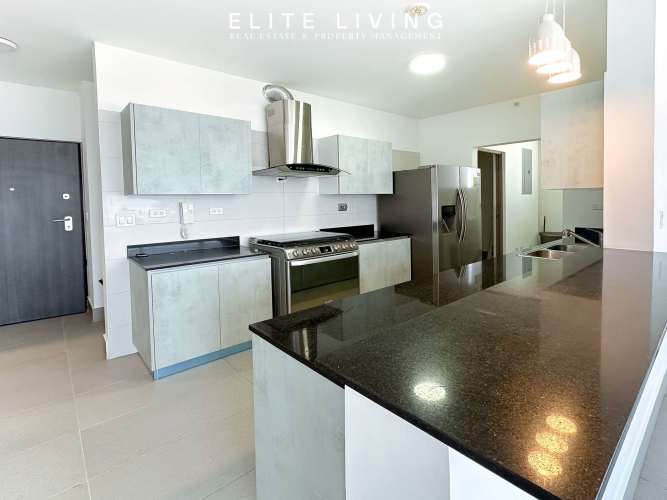 Compact kitchen with stove refrigerator microwave in PH Urbis Tower Panama City near universities