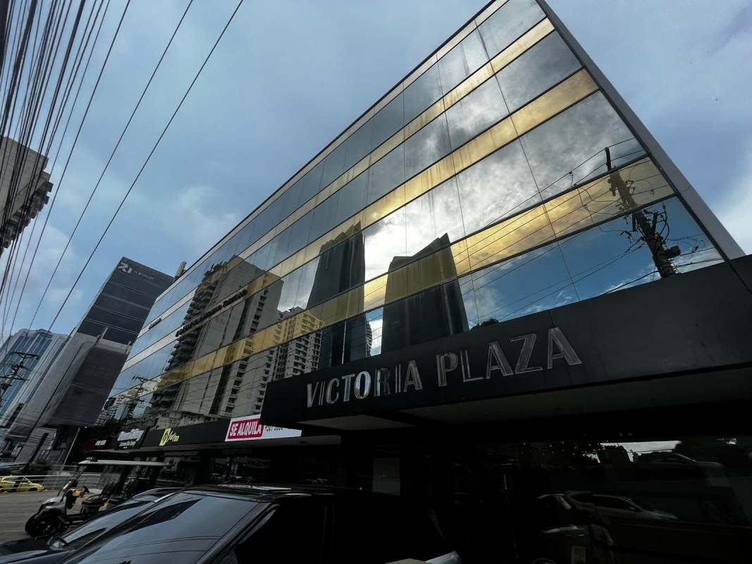 Modern glass facade exterior of Victoria Plaza in Obarrio Panama City commercial district