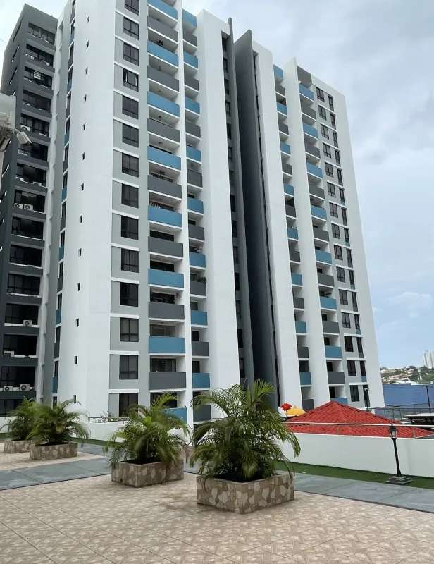 Modern high-rise apartment tower with balconies in Condado del Rey Panama City