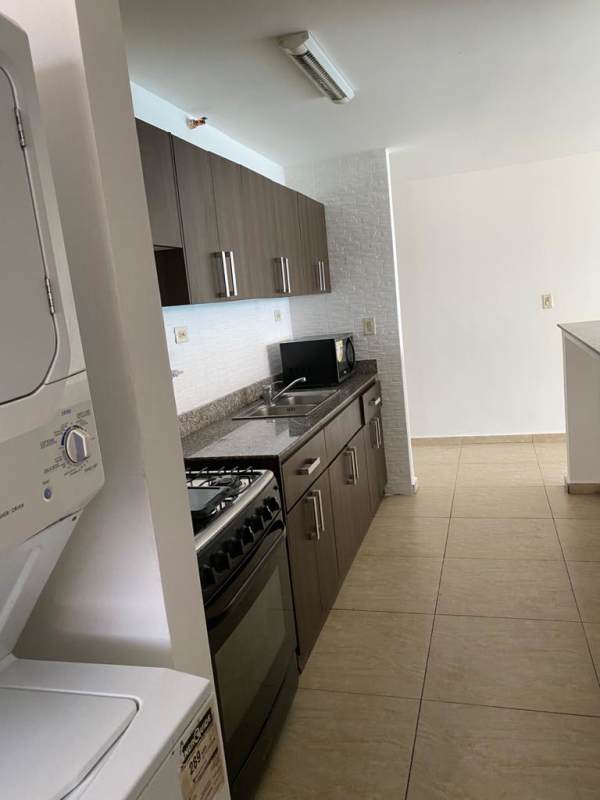 Spacious bedroom with natural light, tile floors, built-in wardrobe, Panama apartment