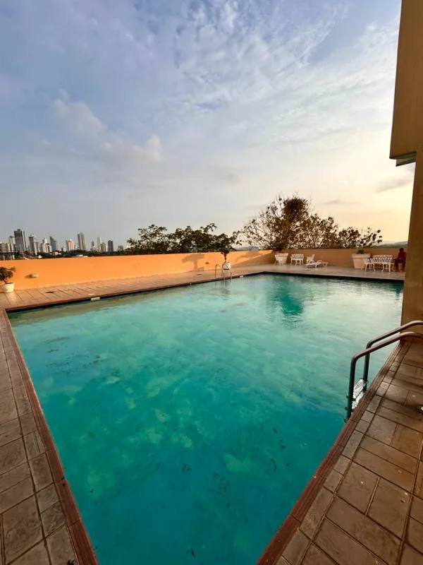 Bedroom with AC unit large windows city skyline view Edison Park Panama apartment rental