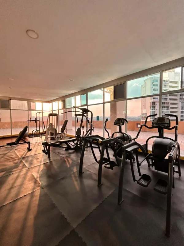 Modern gym with large windows and city view PH Edison Park Tower Panama