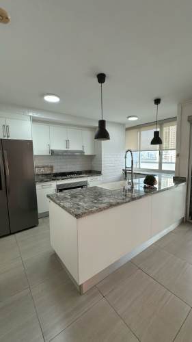 Private balcony with glass railings overlooking Panama City skyline from PH Pacific Sea San Francisco