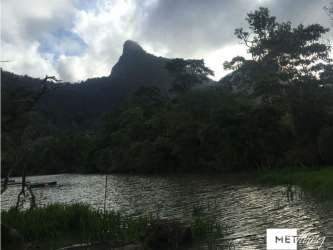 Scenic lake lagoon with mountain landscape Cerro Picacho behind near San Carlos Panama