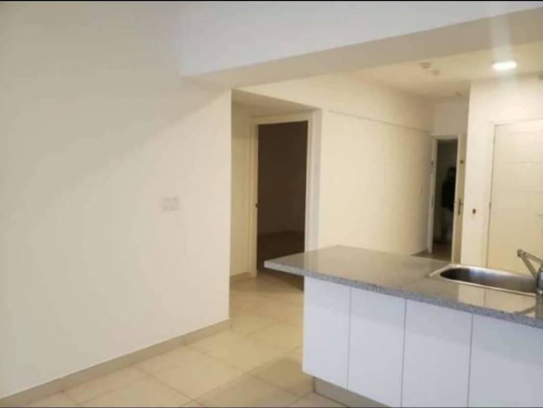 Granite countertop modern kitchen leading to interior hallway in PH White Tower Panama